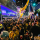 Lakers fans celebrate in front of the Staples Center on October 11, 2020 in Los Angeles, California. People gathered to celebrate after the Los Angeles Lakers defeated the Miami Heat in game 6 of the NBA finals.